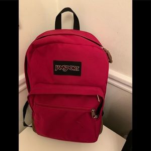 Jansport Pinkish/Red backpack with brown suede bottom.
